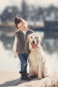 A child with a dog