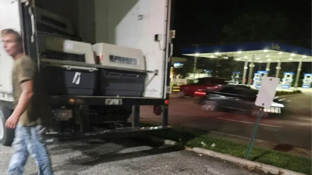 The cargo truck, carrying 18 police German Shepherds, pulled over with a busted AC, causing the death of at least 8 dogs | Photo source: Humane Society of Hobart via AP