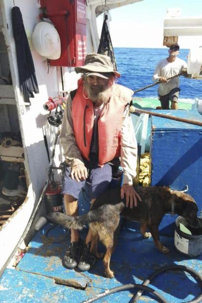 Mr Shaddock sits with Bella after being rescued by a Mexican tuna boat (Photo by :Grupomar/Atun Tuny)